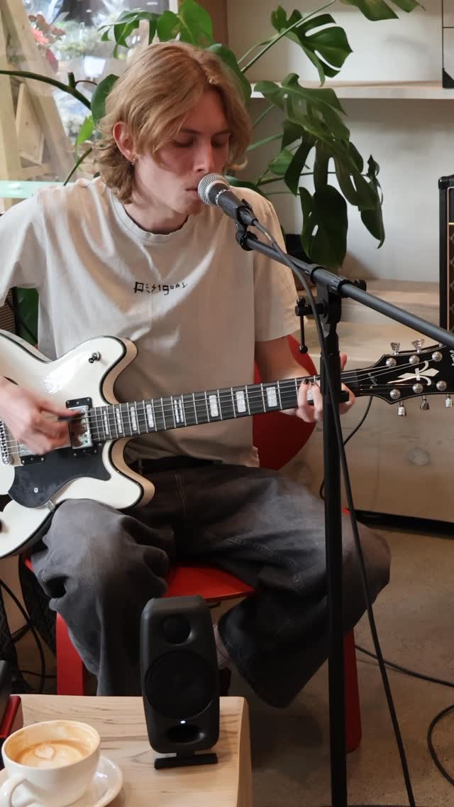 A songwriter playing a live session inside Octave